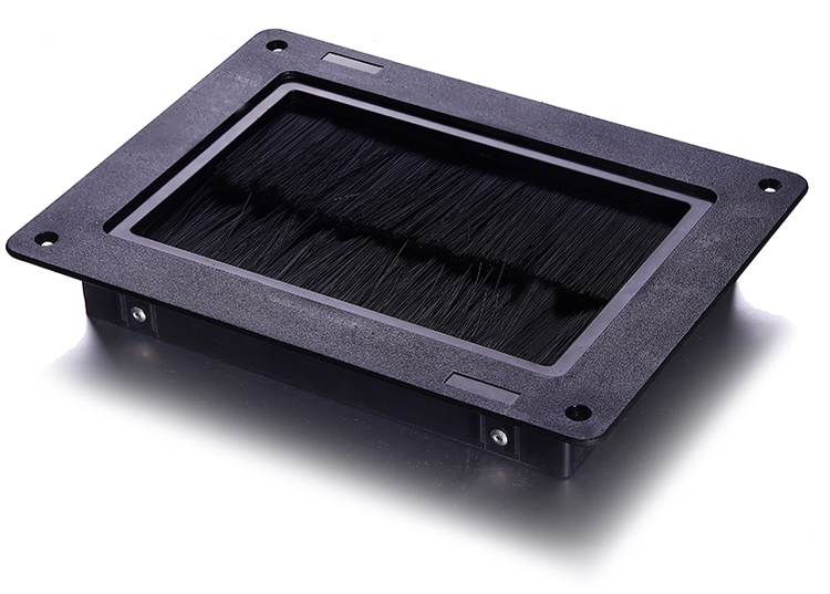 This is a picture of a brush grommet used mainly in computer rooms that sits inside the floor