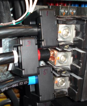 This is a picture of a close of of 300A CTs installed on a switchboard